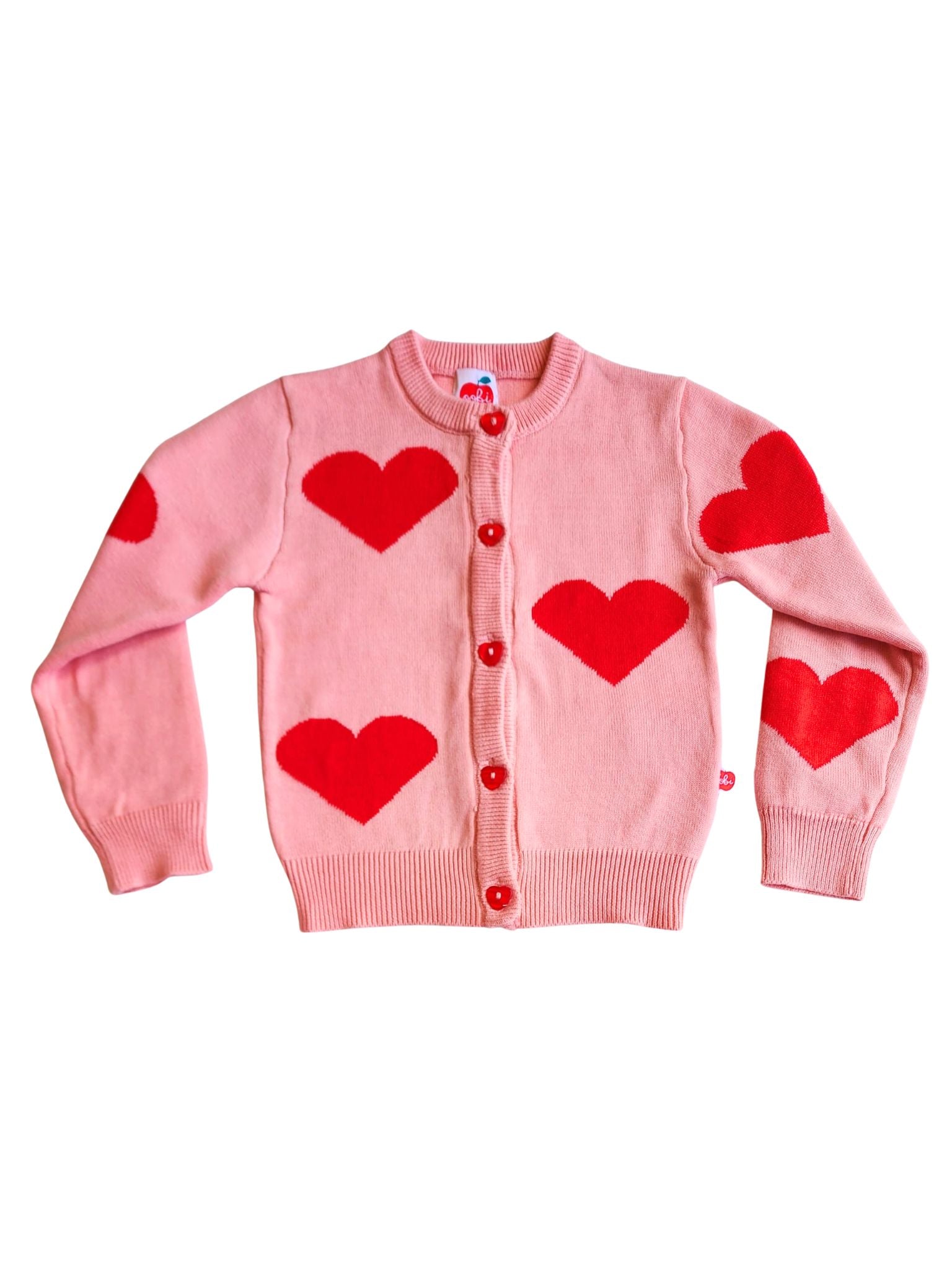 Introducing the Knitwear Maxine Pink with Red Hearts Cardigan: a delightful cotton knit featuring red heart designs and matching heart-shaped buttons, set against a white backdrop.