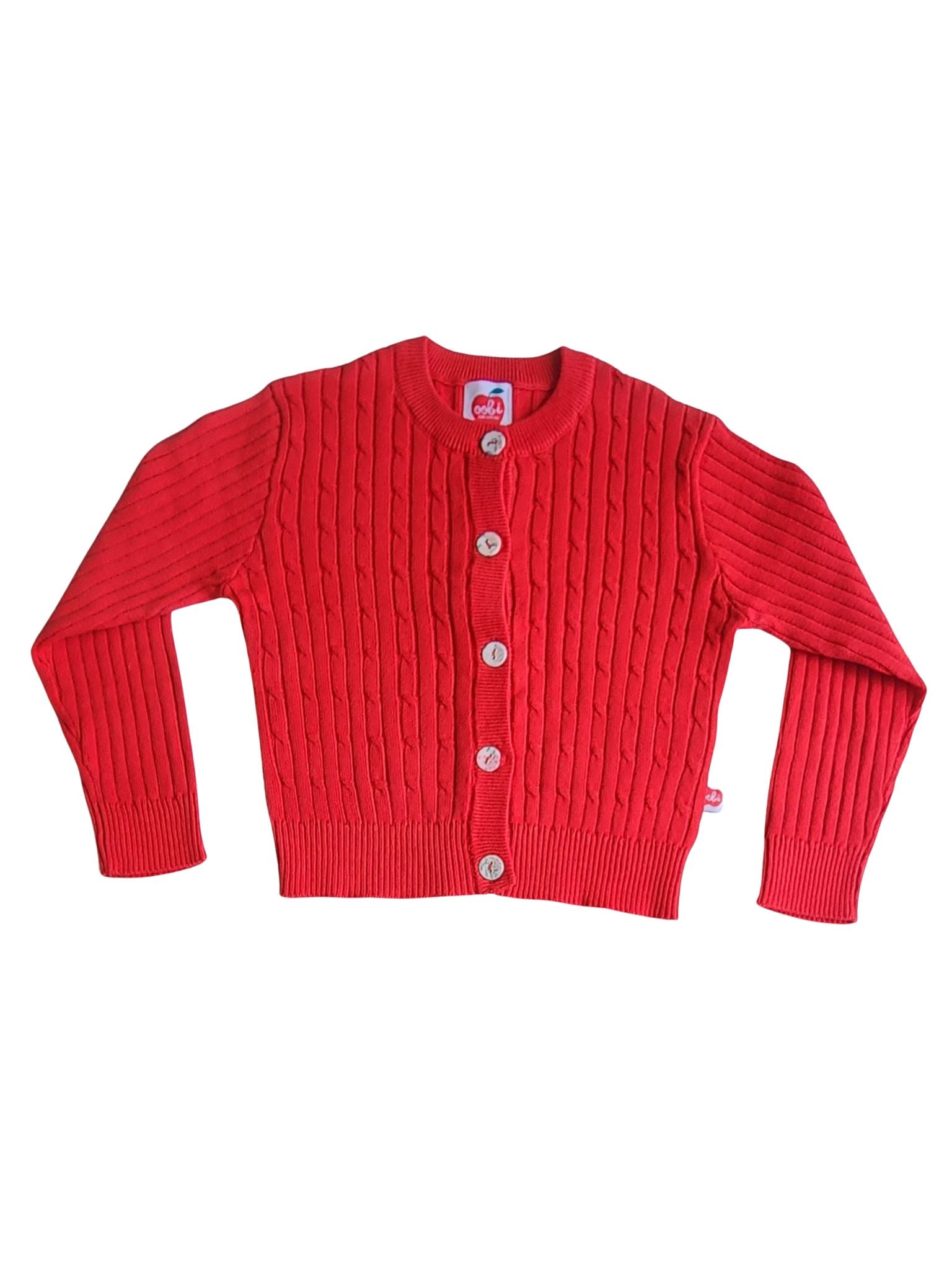 The Maxine Red Cardigan by Knitwear, made of luxurious cotton cable knit, showcases a round neckline and five sleek fabric-covered buttons. Laid flat on a white backdrop, it radiates timeless charm.