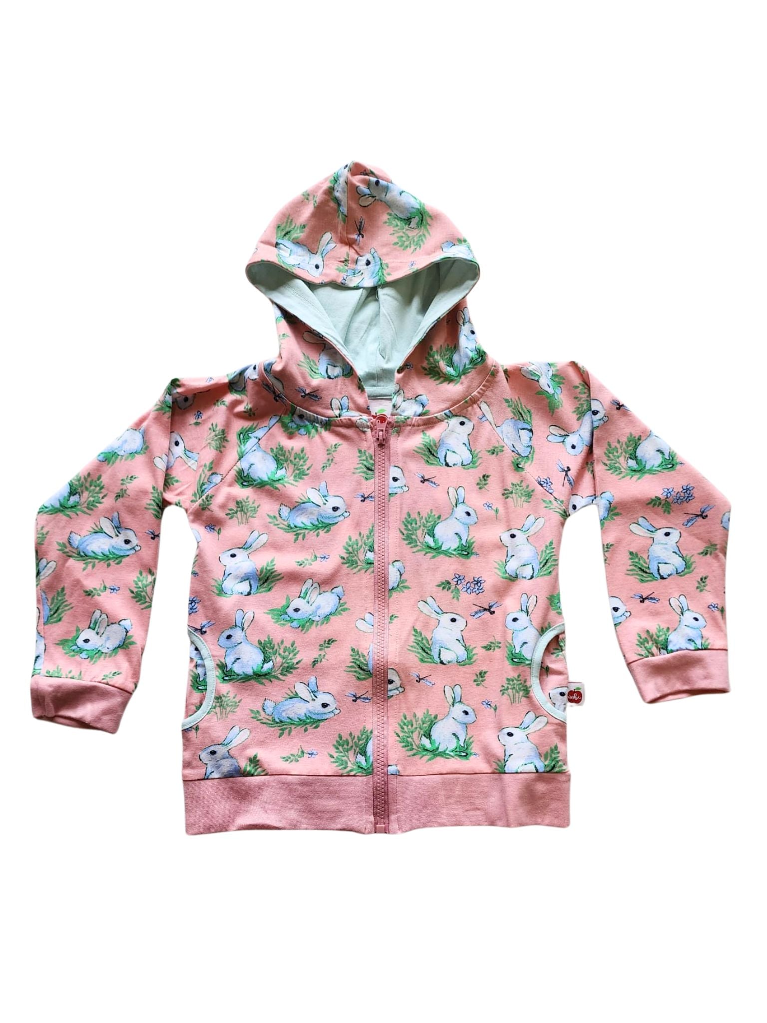 The Pink Bun-Buns Zadie Jacket by Bun-Buns is a cute children's pink hoodie with a zip, adorned with white bunnies and green leaves. This cotton hooded jersey pairs perfectly with matching soft jersey pants for a complete outfit.