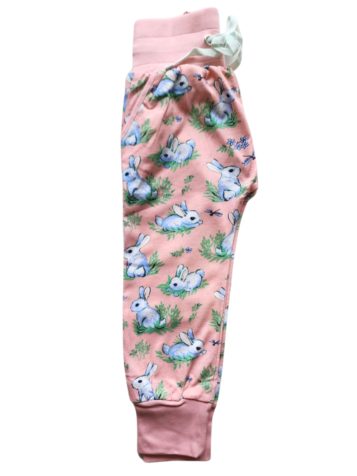 The Bun-Buns best-seller, Bun Bun Soft Jersey Pants in pink, boasts a charming pattern of white rabbits and greenery with a comfy elastic waist for daily wear.