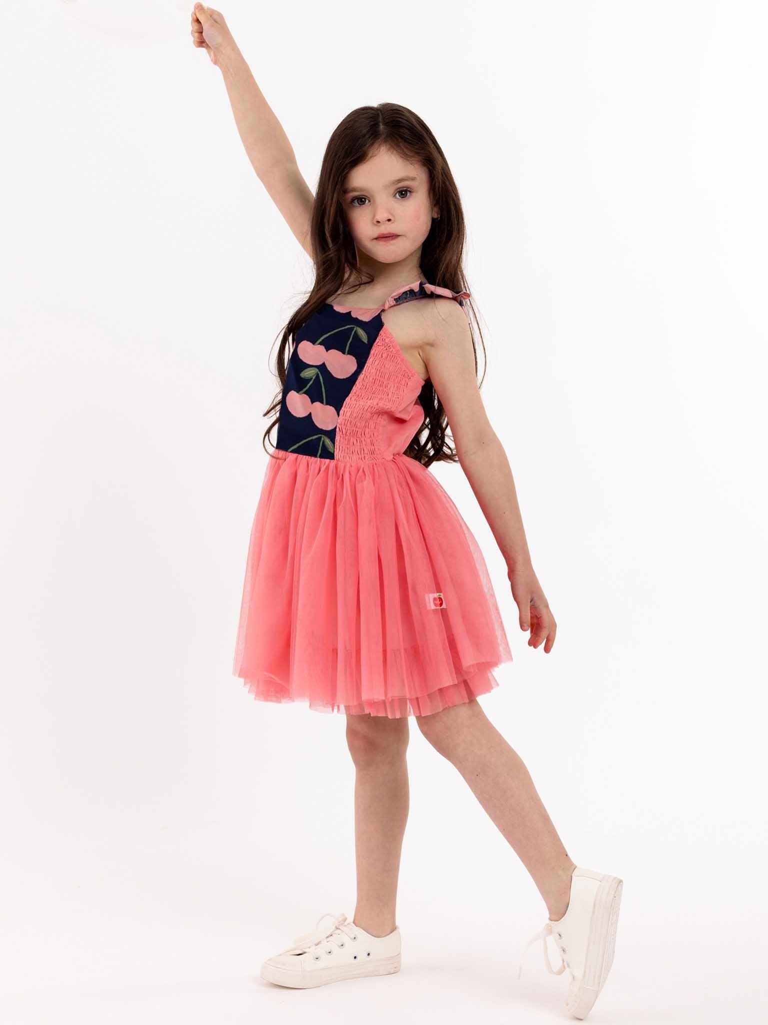 A beautiful Navy Cherry Belle twirl-approved in her pink tulle dress.